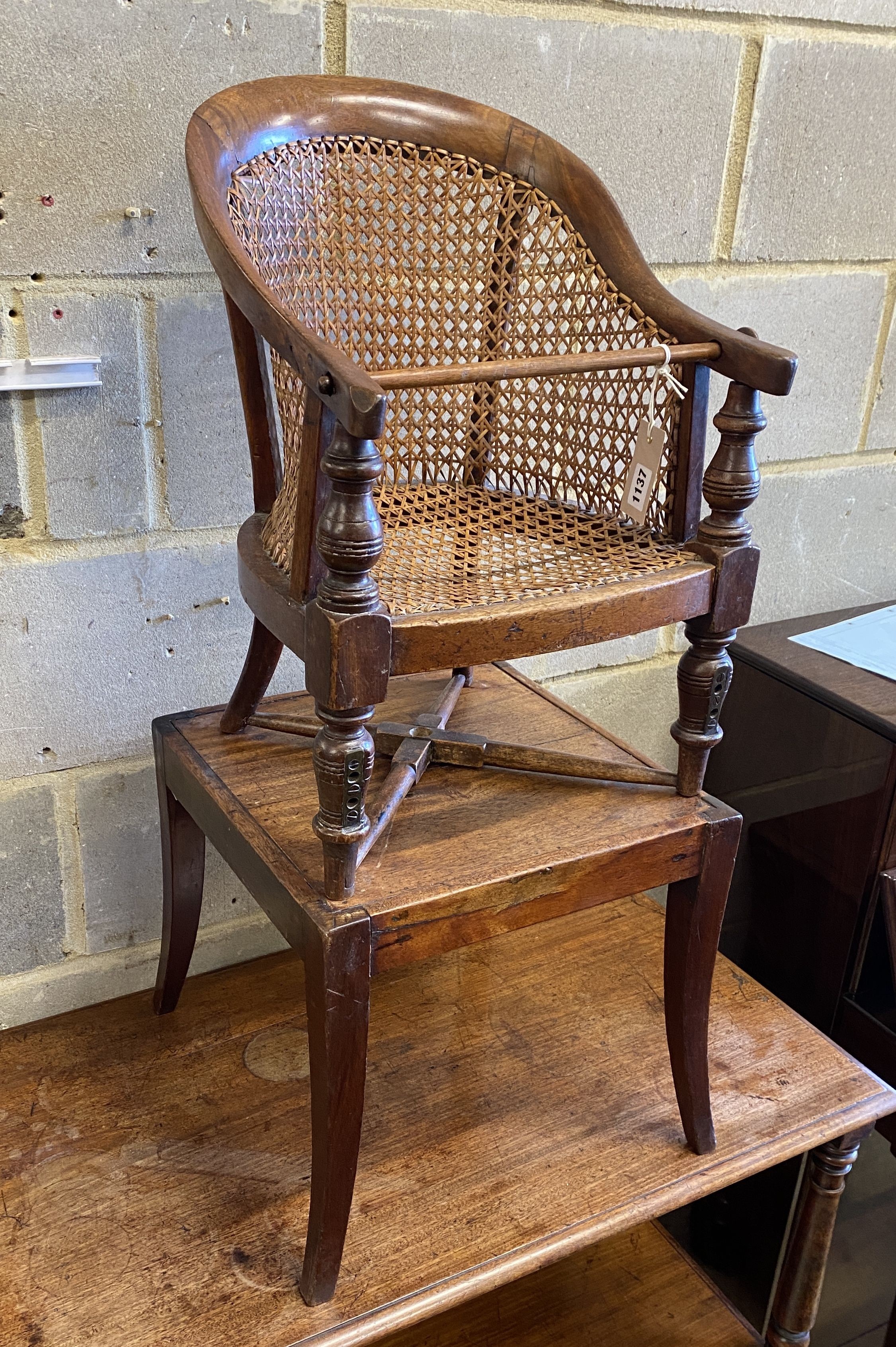 A Victorian caned mahogany child's high chair on stand, width 39cm, depth 39cm, height 90cm